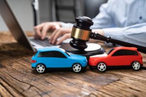 A car accident lawyer discussing a car accident case with a client, focusing on legal strategies, responsibility, and compensation claims within the context of car accidents and insurance coverage.