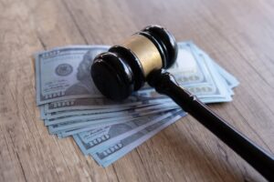 Gavel and Money on account of compensation in pedestrian accident 