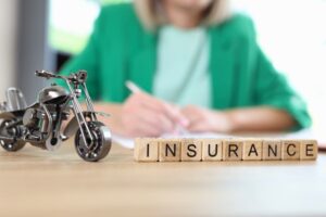 Motorcycle model and word insurance on table