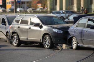 Collision of three cars at a crosswalk no casualties